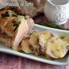 Arrosto di maiale al latte, tenero e succulento, servito con la sua salsa cremosa e profumato al rosmarino.